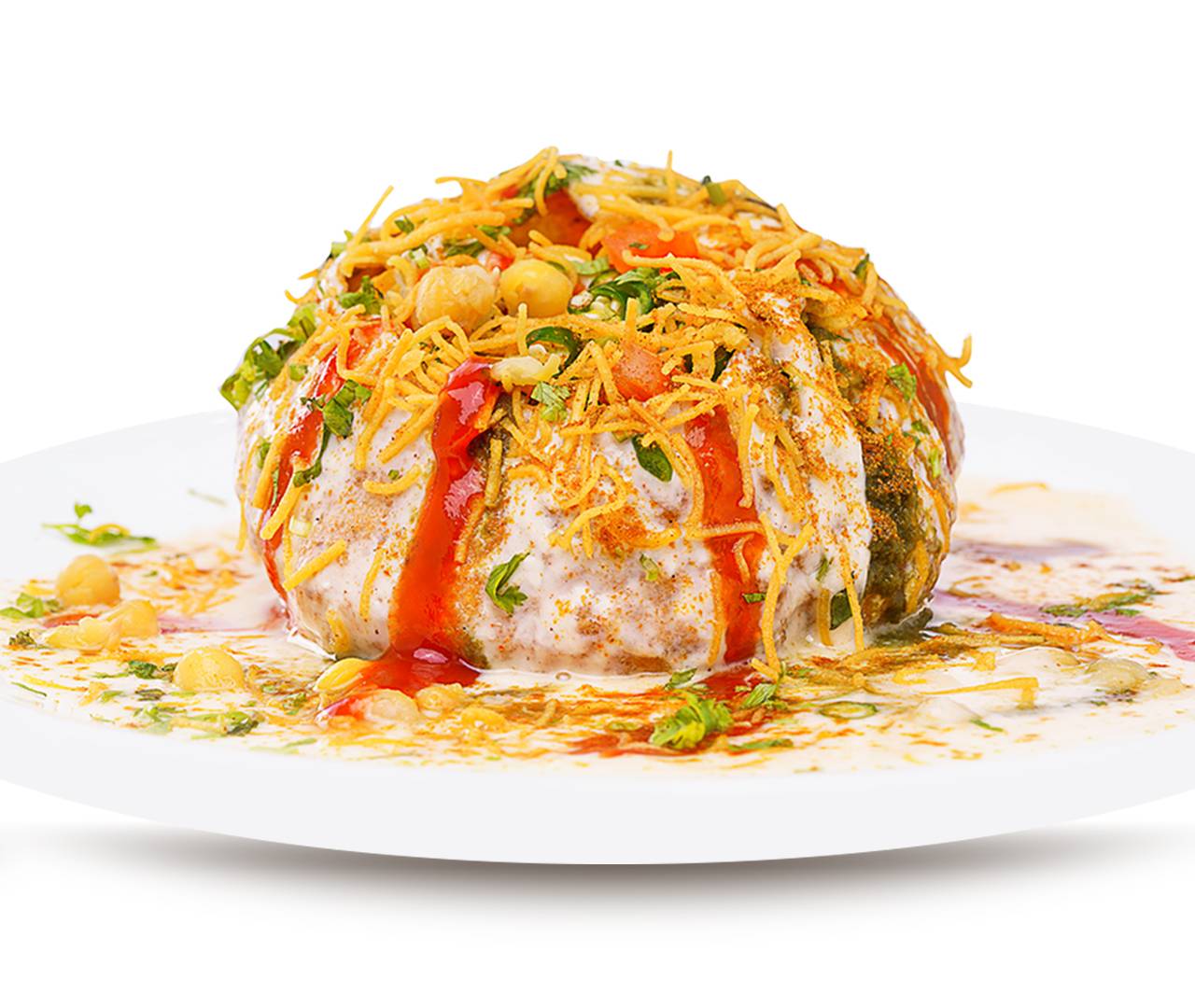 A vibrant plate of dahi puri topped with yogurt, tangy sauces, crunchy sev, and garnished with herbs, showcasing a colorful Indian street food dish.